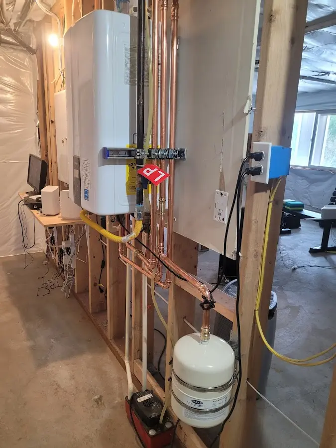 Licensed plumber repairing a kitchen sink in Providence